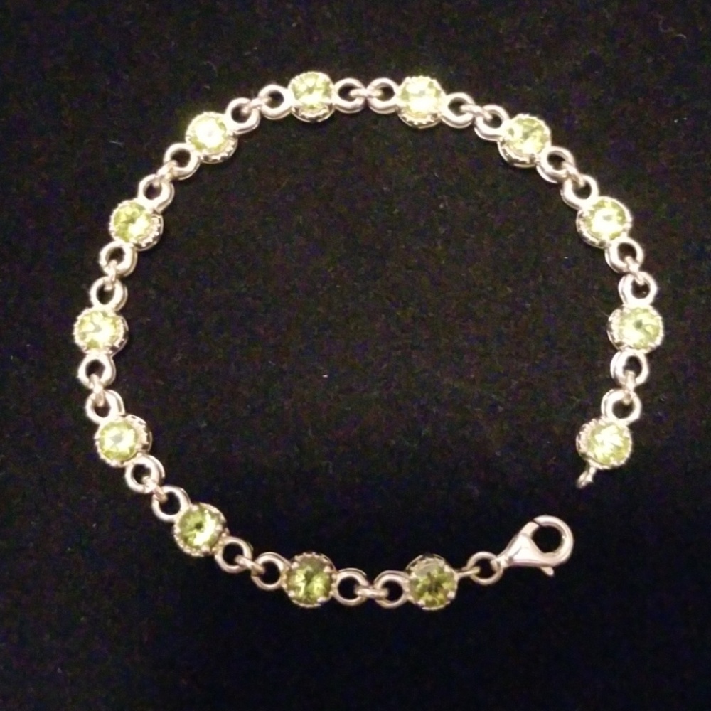 Sterling silver and pale green stone bracelet.
